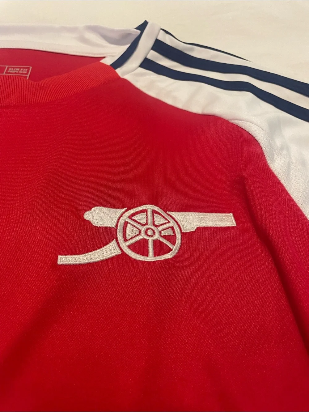Adidas Red and White Arsenal Football Jersey with navy accents.